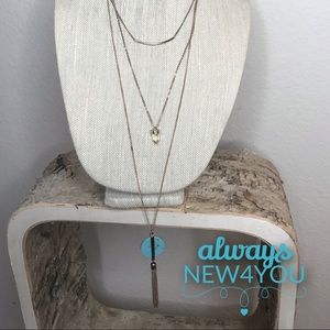 Gold tone layered necklace with turquoise accent